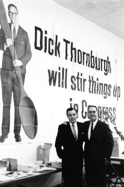Thornburgh in front of billboard: "Dick Thornburgh will stir things up in Congress" 1966